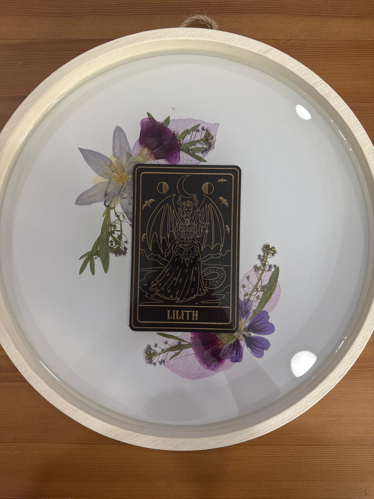 Lilith Black Card Round Wood Resin Art Piece with Purple and Green Pressed Flowers